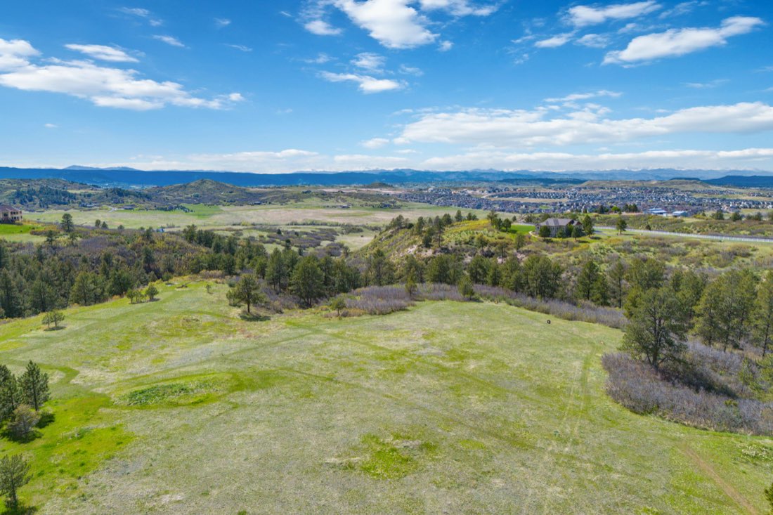 Spring meadows rolling toward the Front Range